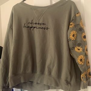 I am selling a green casual sweat shirt with yell flowers on the left arm.